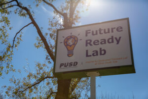The sign for the PUSD Future Ready Lab Inspired by Qualcomm Thinkabit Lab.