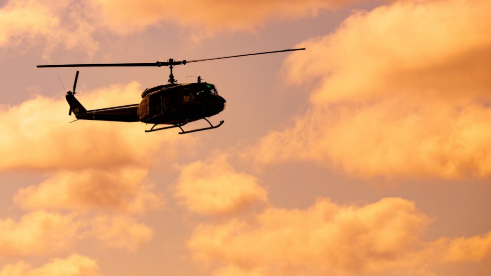 helicopter in sunset sky