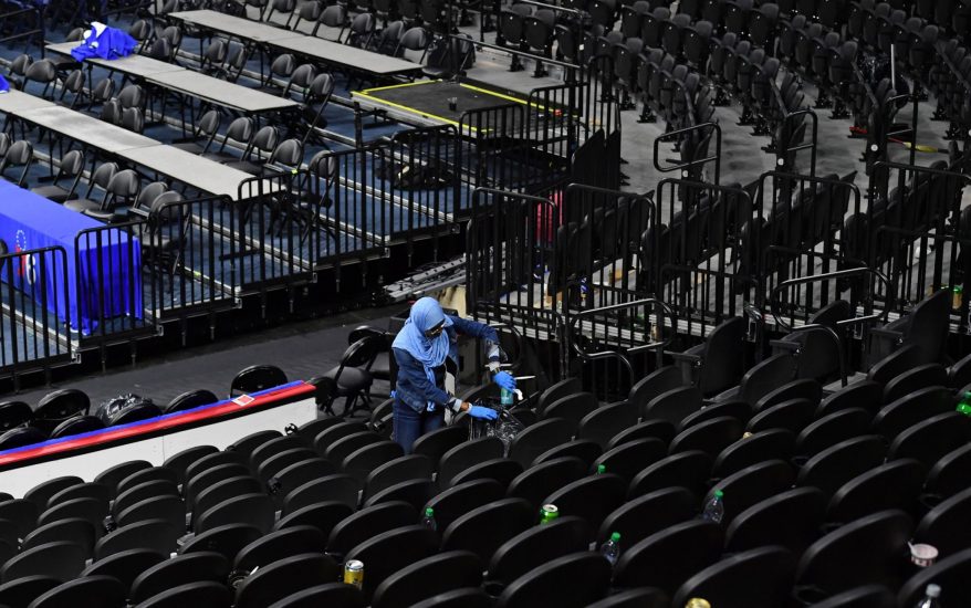 worker-cleaning-arena-crossing-broad